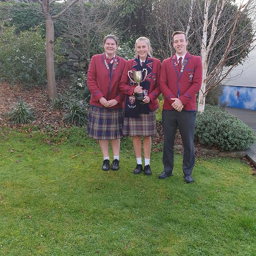 Left to right 2019 sports prefects Savannah Laws, Ashlee Middleton and Ambrose Lee , show off the 2019 Co-ED Sports Trophy Kavanagh College won for the 8th year in a row.