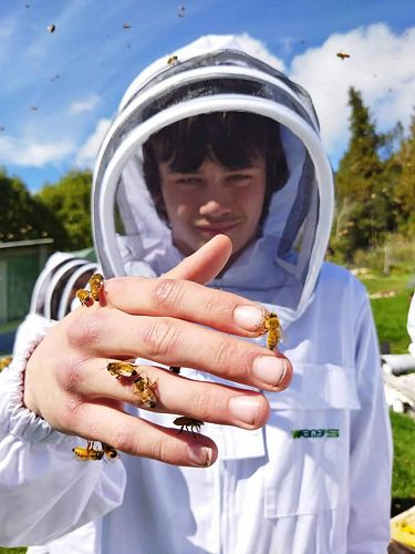 Xavier doing some hands-on work during the short course in Apiculture