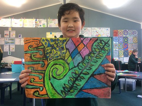 Braeden displays his Koru Art.