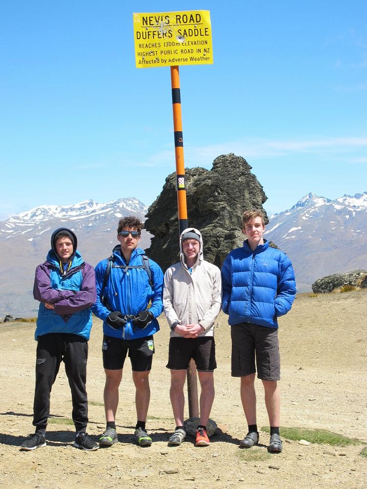 Feeling the burn at the top of Duffers Saddle
          Road Left to right: Jimmy McEwan (support crew), Seamus Leahy,
          Christian Tucker, Michael Sewell