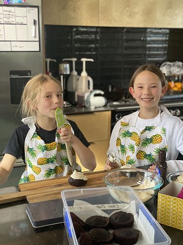Charlotte and Poppy Hussey baking muffins